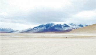 Landscape near Uyuni, Bolivia with a volcano background