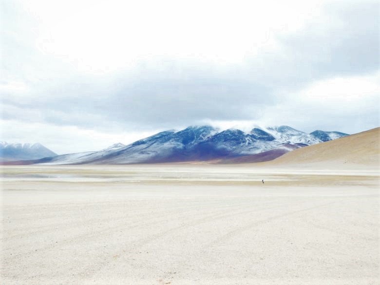 Landscape near Uyuni, Bolivia with a volcano background