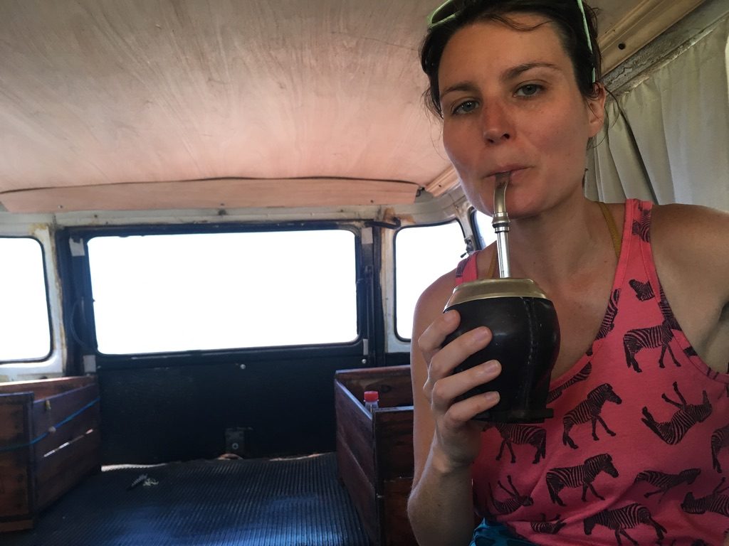 Anna benefits from a warm yerba mate tea in the back of a van