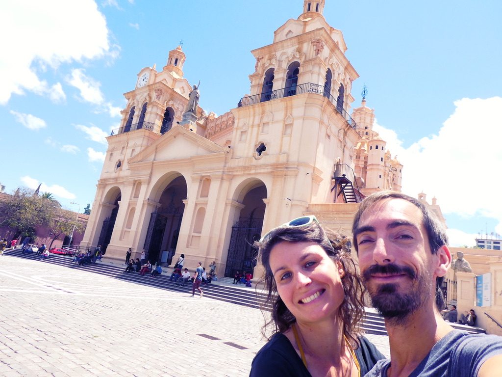 Smiling couple in front of Catedral de Córdoba on the main square Argentina