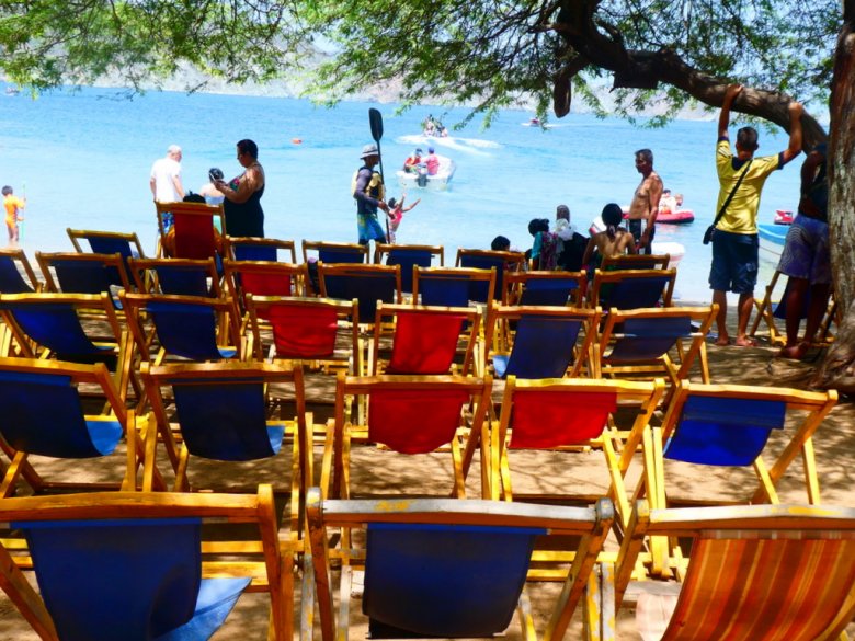 Deck chairs in the best beaches in Colombia. Playa Grande at Santa Marta