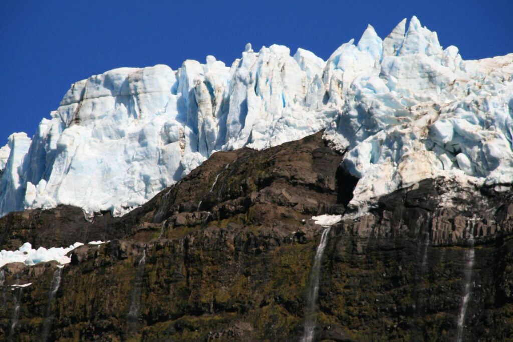 Glacier on top of black rocks in Argentina